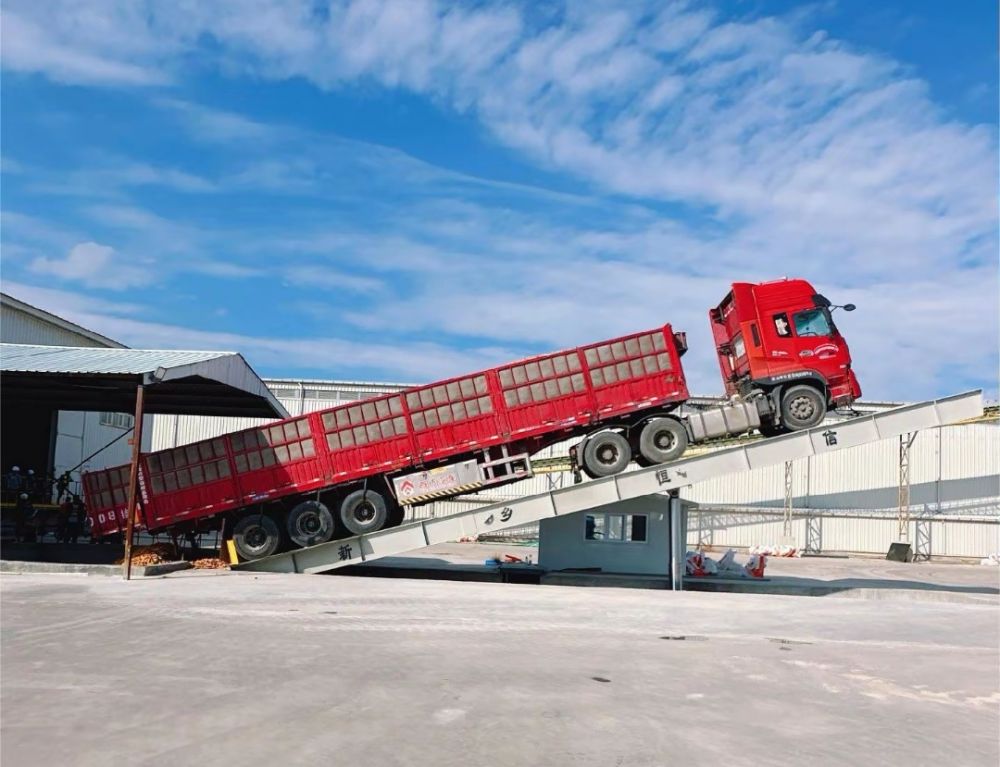 液壓卸車機(jī)、后翻式液壓翻板卸車平臺、河南愛信液壓翻板機(jī)